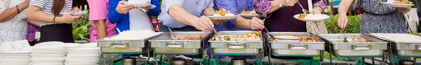 People serving themselves from a buffet