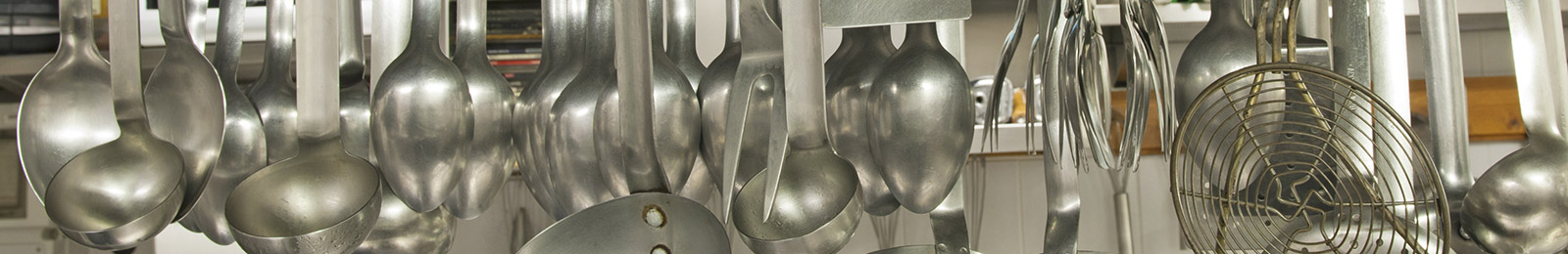 close-up of a rack of ladles and serving spoons